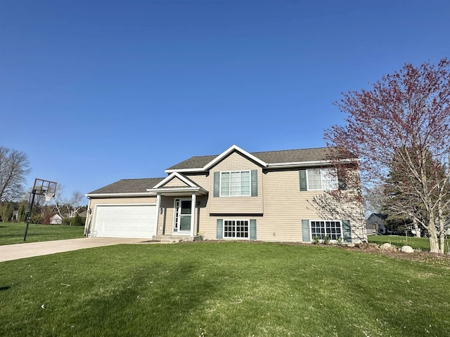 4769 Sandtrap Dr, Traverse City, MI 49685 - split level home with a front yard, driveway, and an attached garage