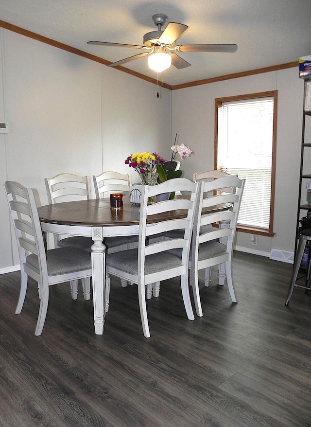 1232 Shiawassee River Rd, Three Rivers, MI 49093 - dining room featuring crown molding, a ceiling fan, dark wood finished floors, and baseboards