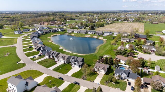 aerial overview of property's location featuring a nearby body of water and nearby suburban area