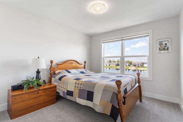 bedroom featuring carpet flooring and baseboards
