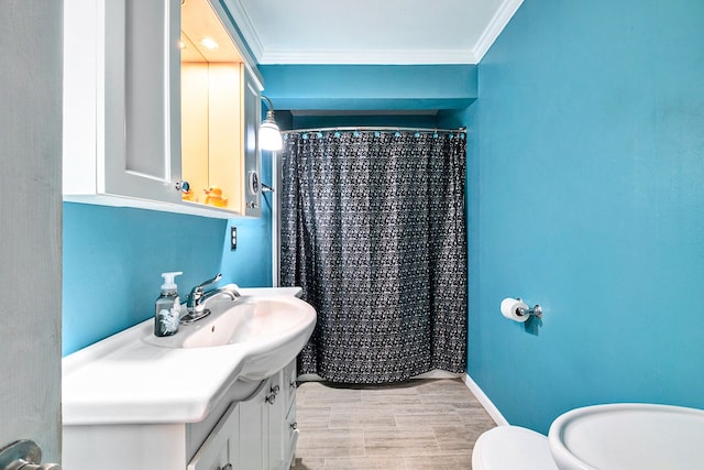 full bath featuring ornamental molding, toilet, vanity, curtained shower, and wood finished floors