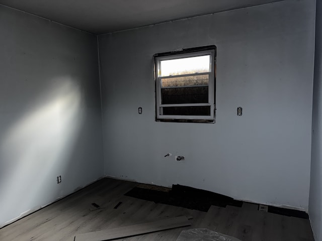 empty room with wood finished floors