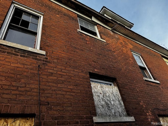 view of home's exterior with brick siding