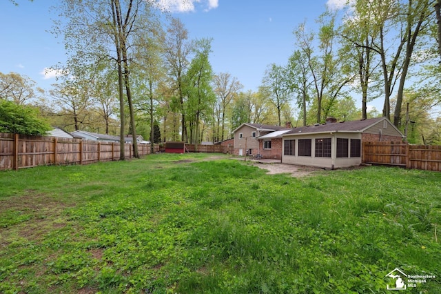 view of yard with a sunroom