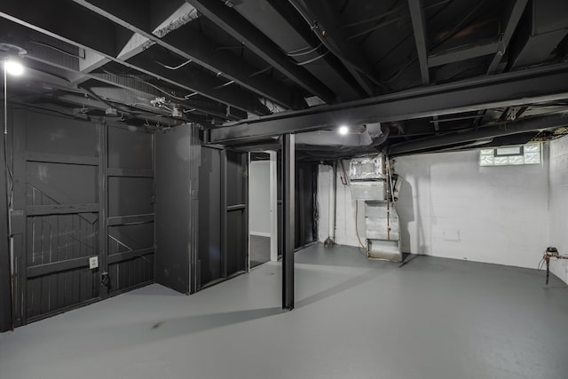 basement featuring heating unit