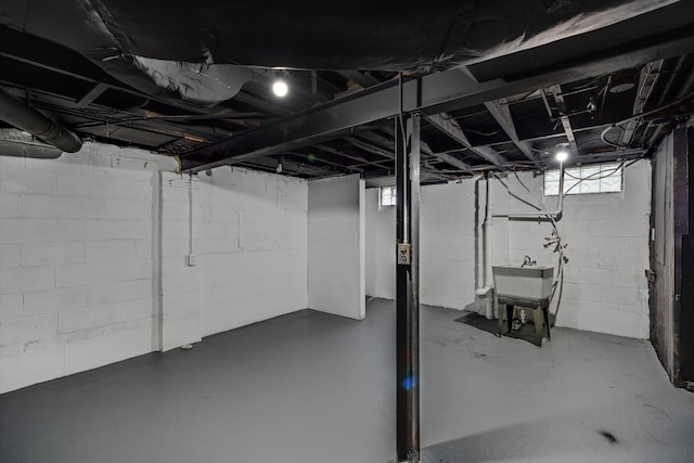 unfinished basement featuring a sink