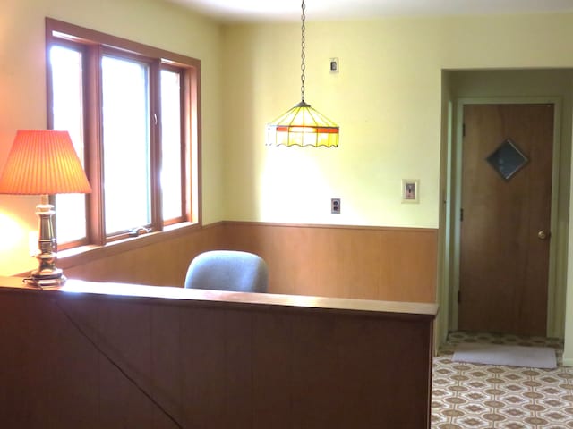 dining area featuring a wainscoted wall