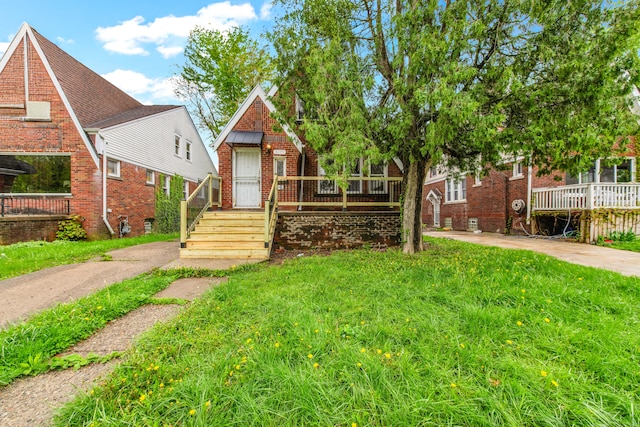 9171 Bishop St, Detroit, MI 48224 - view of front facade featuring brick siding and a front lawn