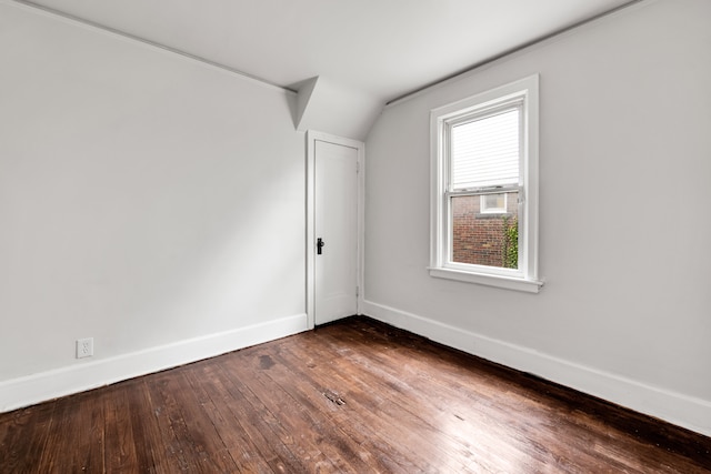 9171 Bishop St, Detroit, MI 48224 - bonus room featuring baseboards, hardwood / wood-style floors, and vaulted ceiling