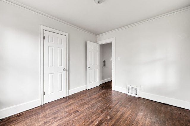 9171 Bishop St, Detroit, MI 48224 - unfurnished bedroom featuring wood finished floors, crown molding, and baseboards