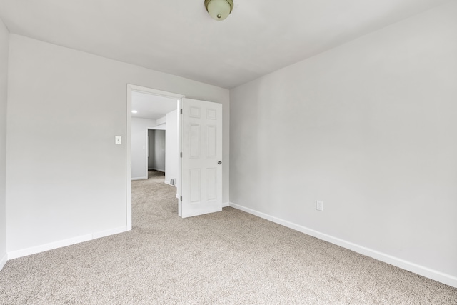 9171 Bishop St, Detroit, MI 48224 - empty room featuring light colored carpet and baseboards