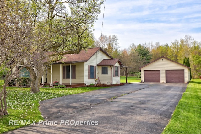 view of front of home featuring a garage, an outdoor structure, a front lawn, a porch, and a shingled roof
