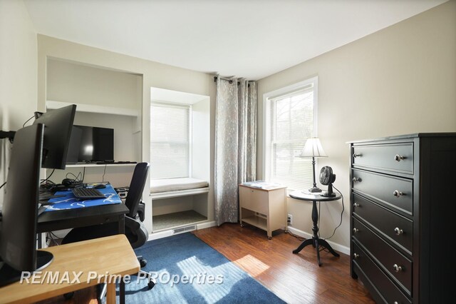 office featuring dark wood-type flooring and baseboards