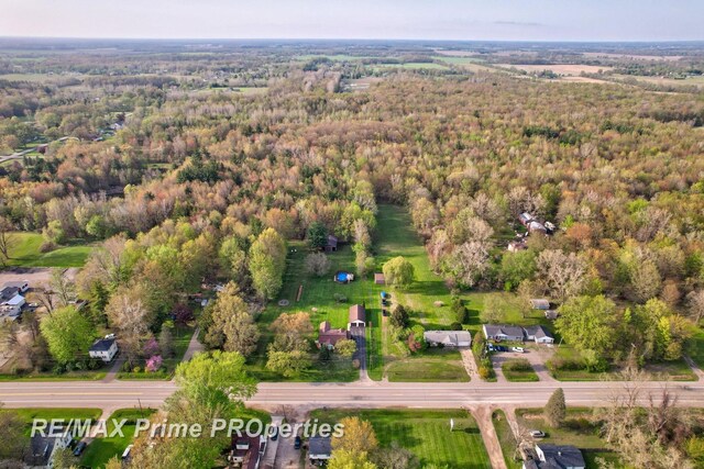 aerial overview of property's location with a forest