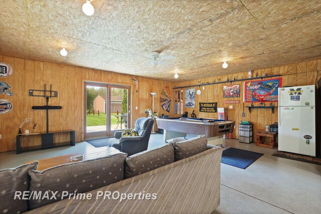 living room with billiards and wooden walls