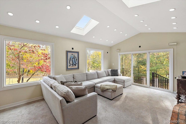 26335 Woodlore Rd, Franklin, MI 48025 - living area with a skylight, lofted ceiling, light carpet, and recessed lighting