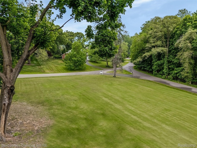 26335 Woodlore Rd, Franklin, MI 48025 - view of community with a lawn and view of wooded area