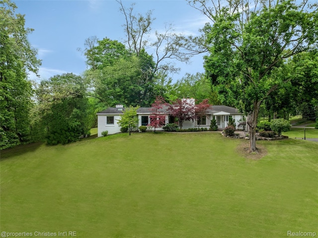 26335 Woodlore Rd, Franklin, MI 48025 - view of front facade with a front yard