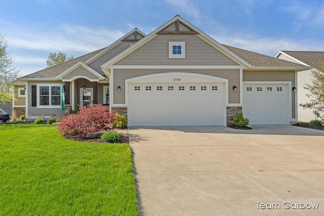 2044 Canopy Dr SW, Byron Center, MI 49315 - craftsman-style house with an attached garage, concrete driveway, a front yard, and stone siding