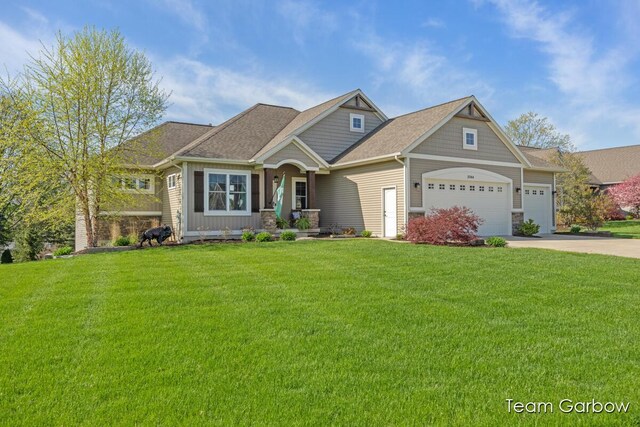 2044 Canopy Dr SW, Byron Center, MI 49315 - craftsman-style home featuring a garage, a front lawn, and driveway