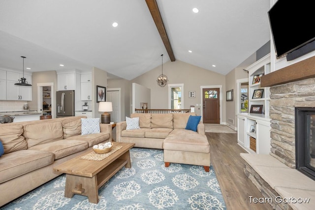 2044 Canopy Dr SW, Byron Center, MI 49315 - living area featuring wood finished floors, recessed lighting, a fireplace, baseboards, and built in shelves