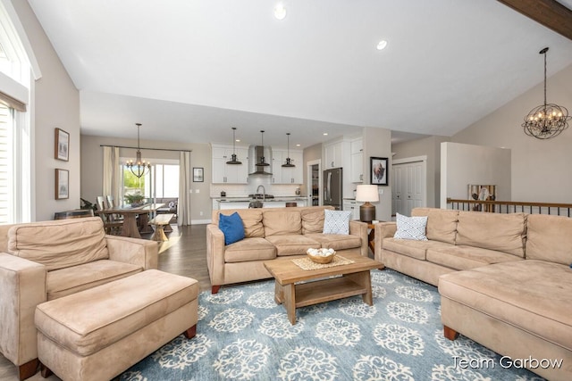 2044 Canopy Dr SW, Byron Center, MI 49315 - living area featuring a chandelier, wood finished floors, recessed lighting, and vaulted ceiling