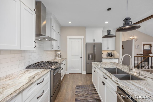 2044 Canopy Dr SW, Byron Center, MI 49315 - kitchen featuring appliances with stainless steel finishes, a sink, wall chimney exhaust hood, dark wood-style floors, and white cabinets