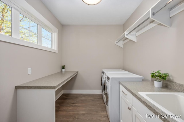 2044 Canopy Dr SW, Byron Center, MI 49315 - laundry room featuring washer and clothes dryer, dark wood finished floors, baseboards, and cabinet space