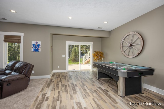2044 Canopy Dr SW, Byron Center, MI 49315 - recreation room featuring recessed lighting, wood finished floors, baseboards, and healthy amount of natural light