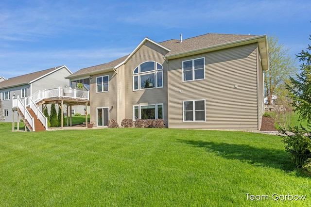 2044 Canopy Dr SW, Byron Center, MI 49315 - back of property with a wooden deck, a yard, and stairs