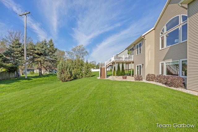 2044 Canopy Dr SW, Byron Center, MI 49315 - view of grassy yard with a patio and a wooden deck