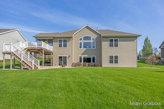 2044 Canopy Dr SW, Byron Center, MI 49315 - back of property with stairway, a deck, and a lawn