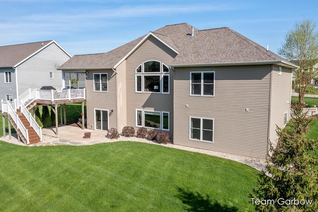 2044 Canopy Dr SW, Byron Center, MI 49315 - back of property with a patio, a yard, a wooden deck, and a shingled roof