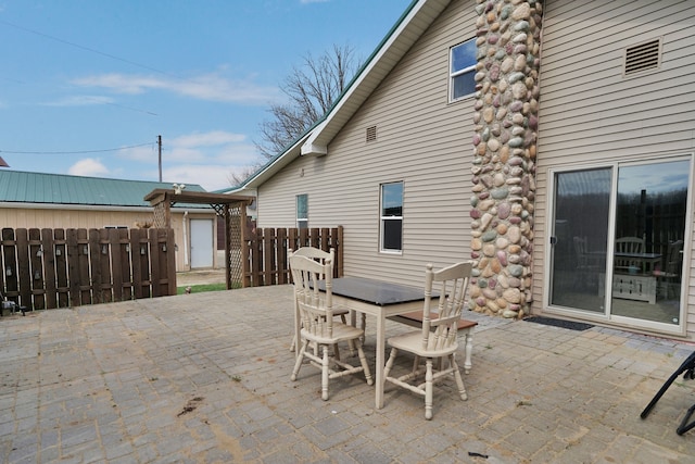 view of patio / terrace featuring fence and outdoor dining area