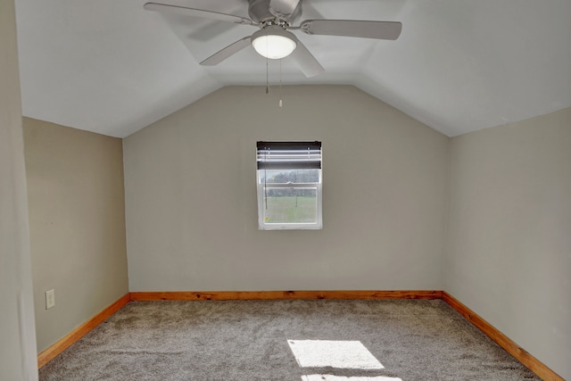 bonus room with carpet, vaulted ceiling, baseboards, and ceiling fan