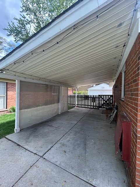 29424 Shirley Ave, Madison Heights, MI 48071 - view of car parking with an attached carport, driveway, and fence