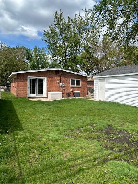 29424 Shirley Ave, Madison Heights, MI 48071 - back of house with a yard, central AC unit, and brick siding