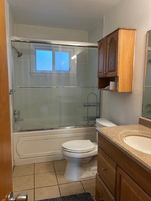 29424 Shirley Ave, Madison Heights, MI 48071 - full bath featuring tile patterned flooring, enclosed tub / shower combo, vanity, and toilet