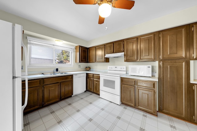 15690 Grainger Dr, Clinton Township, MI 48038 - kitchen featuring white appliances, a sink, light countertops, and light flooring
