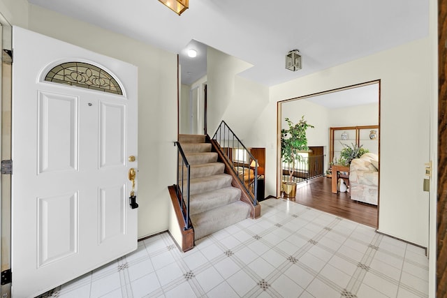 15690 Grainger Dr, Clinton Township, MI 48038 - entrance foyer featuring tile patterned floors and stairs