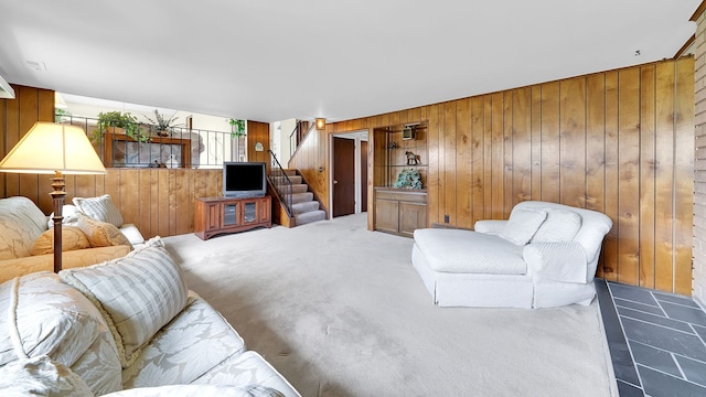 15690 Grainger Dr, Clinton Township, MI 48038 - carpeted living area with wooden walls and stairway