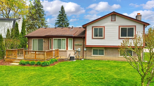 15690 Grainger Dr, Clinton Township, MI 48038 - rear view of property featuring a chimney, a wooden deck, a lawn, and cooling unit