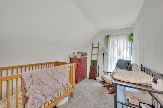 carpeted bedroom with vaulted ceiling