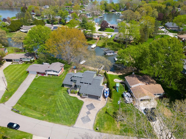 aerial overview of property's location featuring a nearby body of water and nearby suburban area