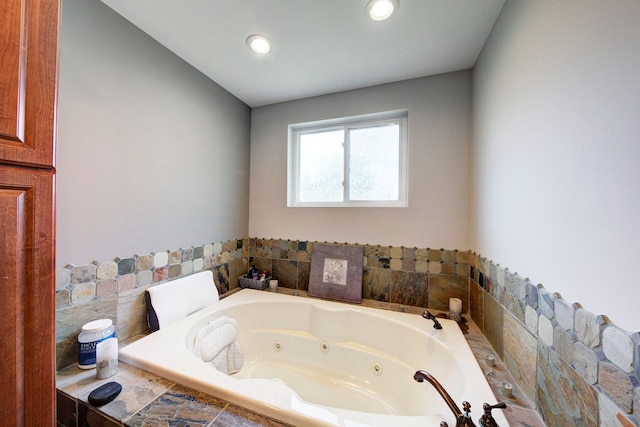 full bathroom with a jetted tub and recessed lighting