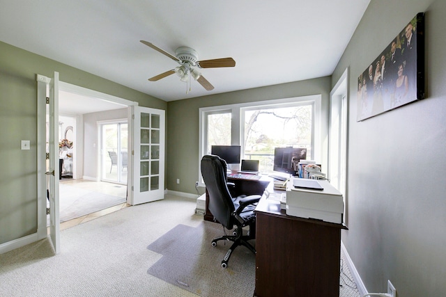 carpeted home office featuring french doors, ceiling fan, and baseboards