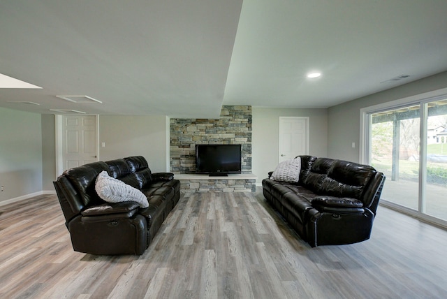 living room featuring wood finished floors and baseboards