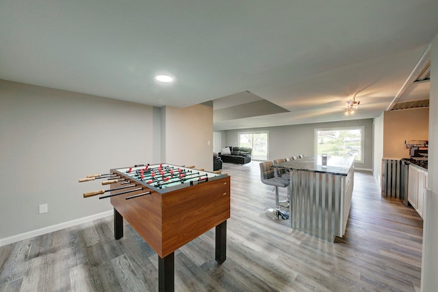playroom featuring wood finished floors, baseboards, and recessed lighting