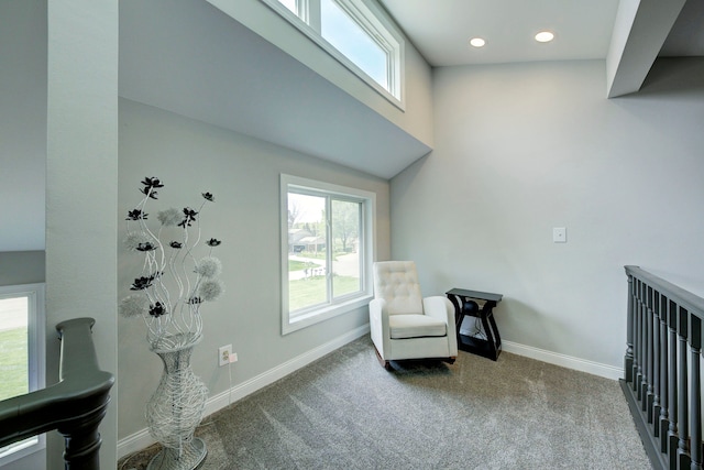 living area with carpet floors, baseboards, and recessed lighting