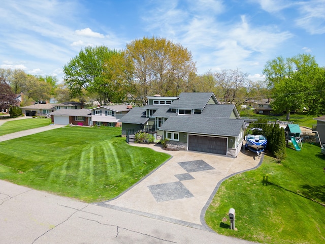 mid-century home featuring stone siding, concrete driveway, a residential view, a front yard, and a shingled roof